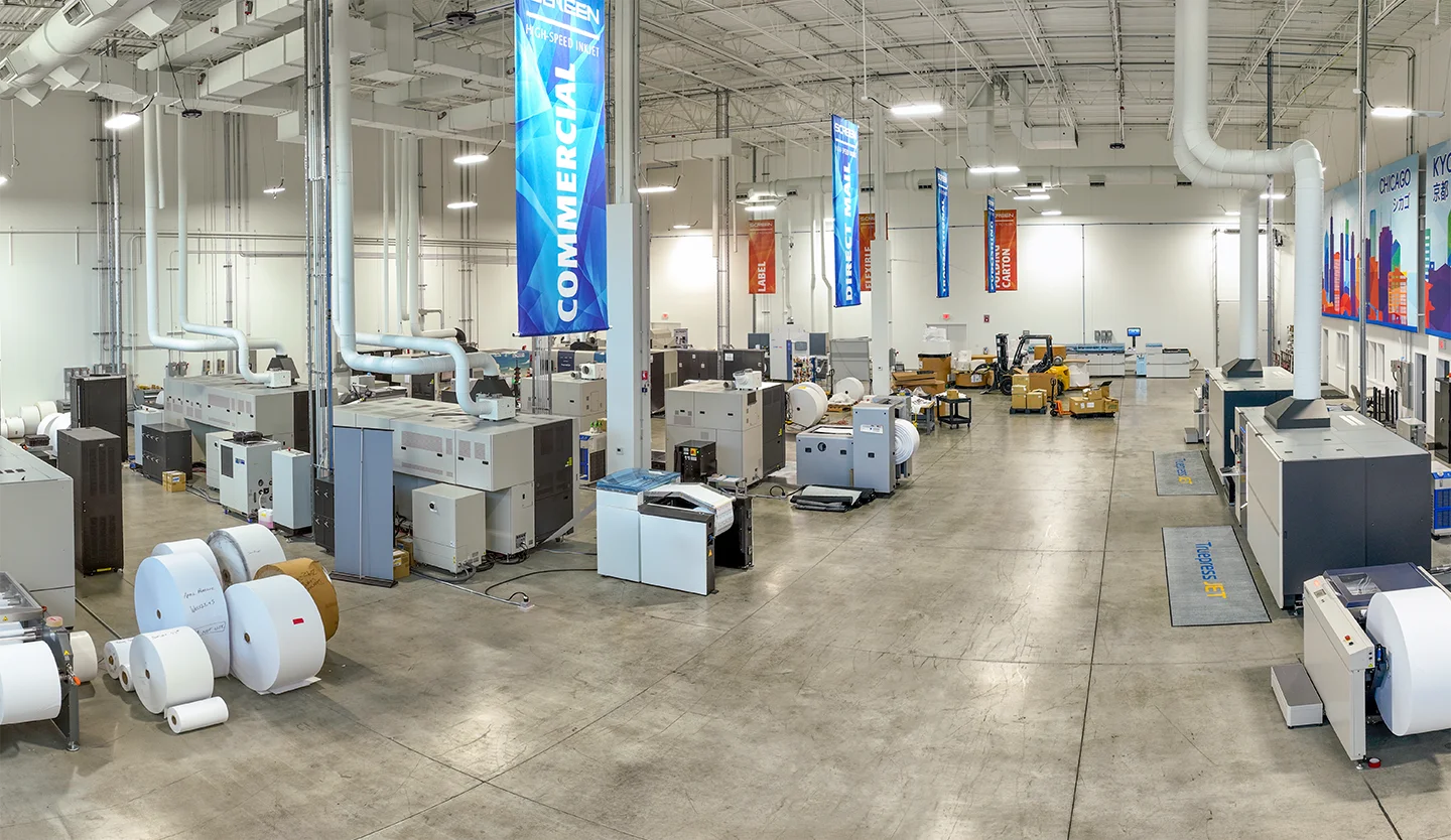 Interior of the SCREEN Inkjet Innovation Center showing multiple digital inkjet presses and finishing devices
