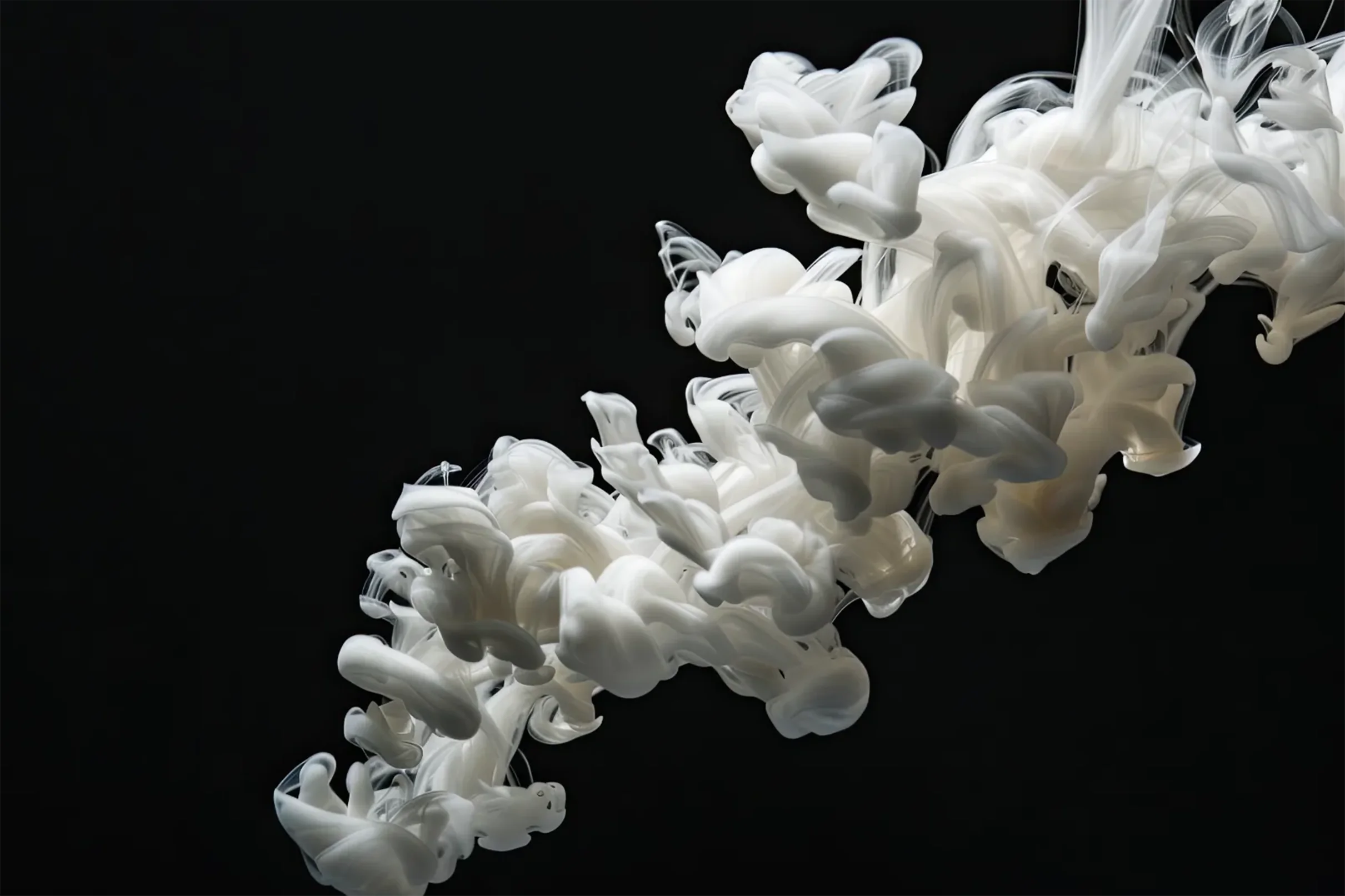 Abstract white ink plume dissolving in water against a black background, representing the quality and flow of white ink for the Truepress PAC 830F.
